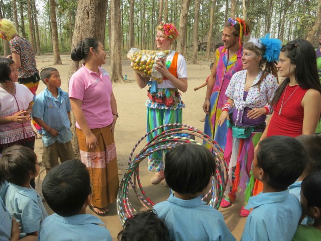After our day show and workshops at Naung Bodeng, a school in a teak forest, a chance to hand over toys and fruit for the children to the head teacher.