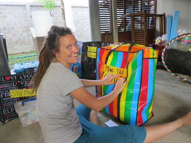 Heather preparing gift bags to donate. We fill them with creative toys, art supplies and musical instruments...